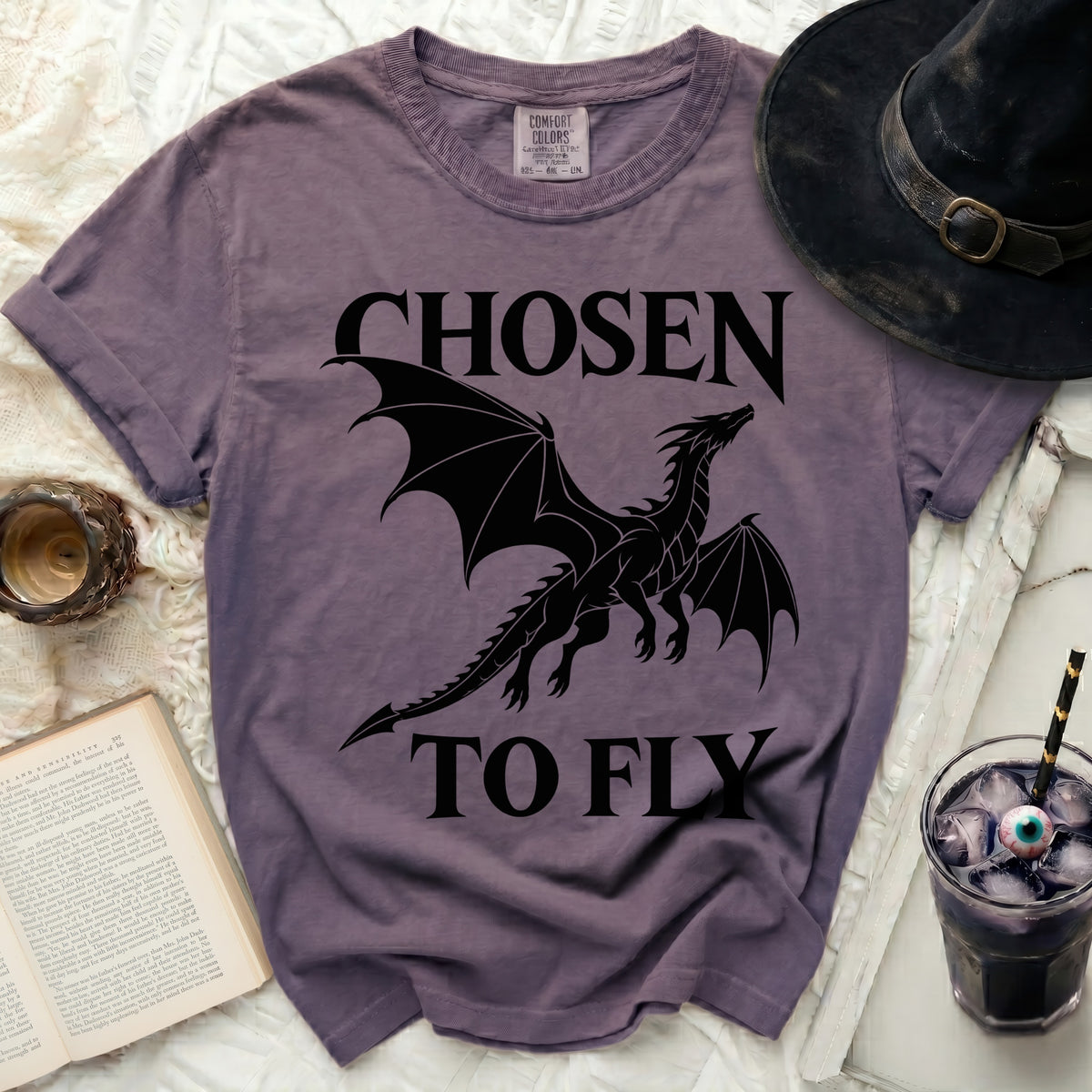 Purple t-shirt with black dragon graphic and text "CHOSEN TO FLY".
