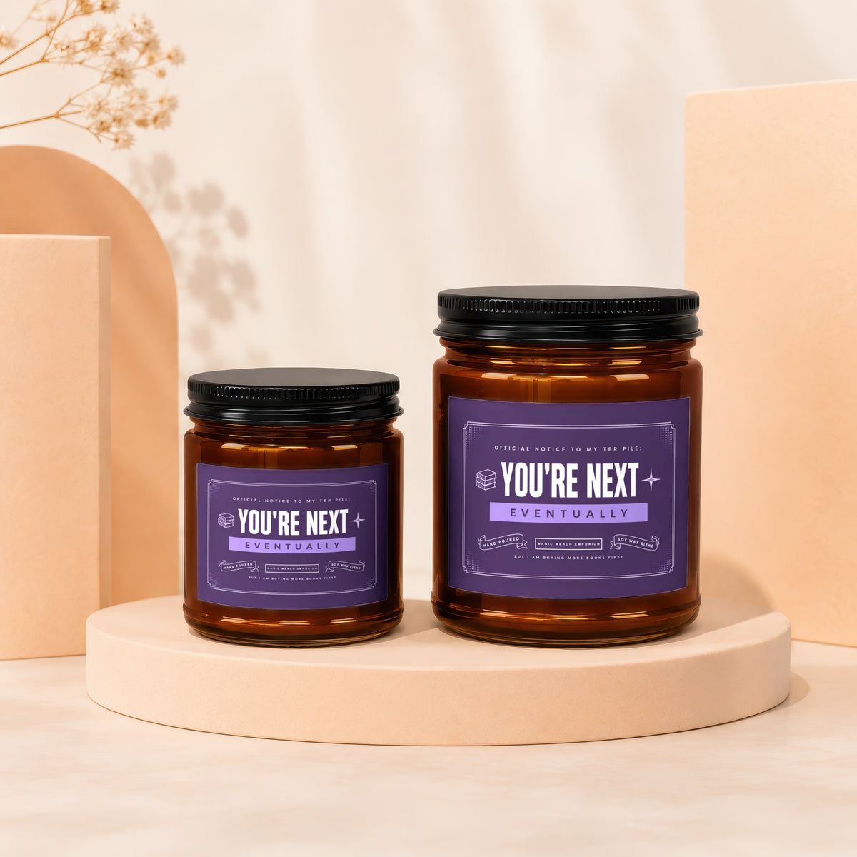 Two amber glass candles with purple labels reading "You're Next" and "Eventually."