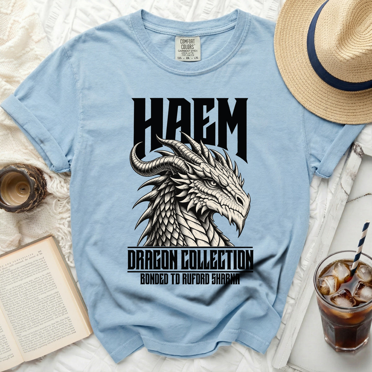 Light blue t-shirt with black HAEM dragon graphic and text.