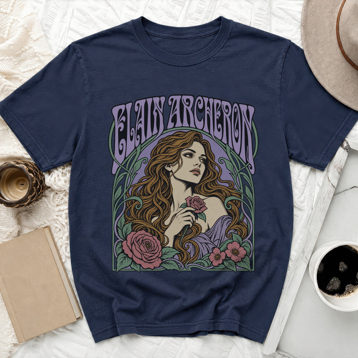 Navy t-shirt with "ELAINE ARCHERON" text and floral illustration of a woman holding a rose.
