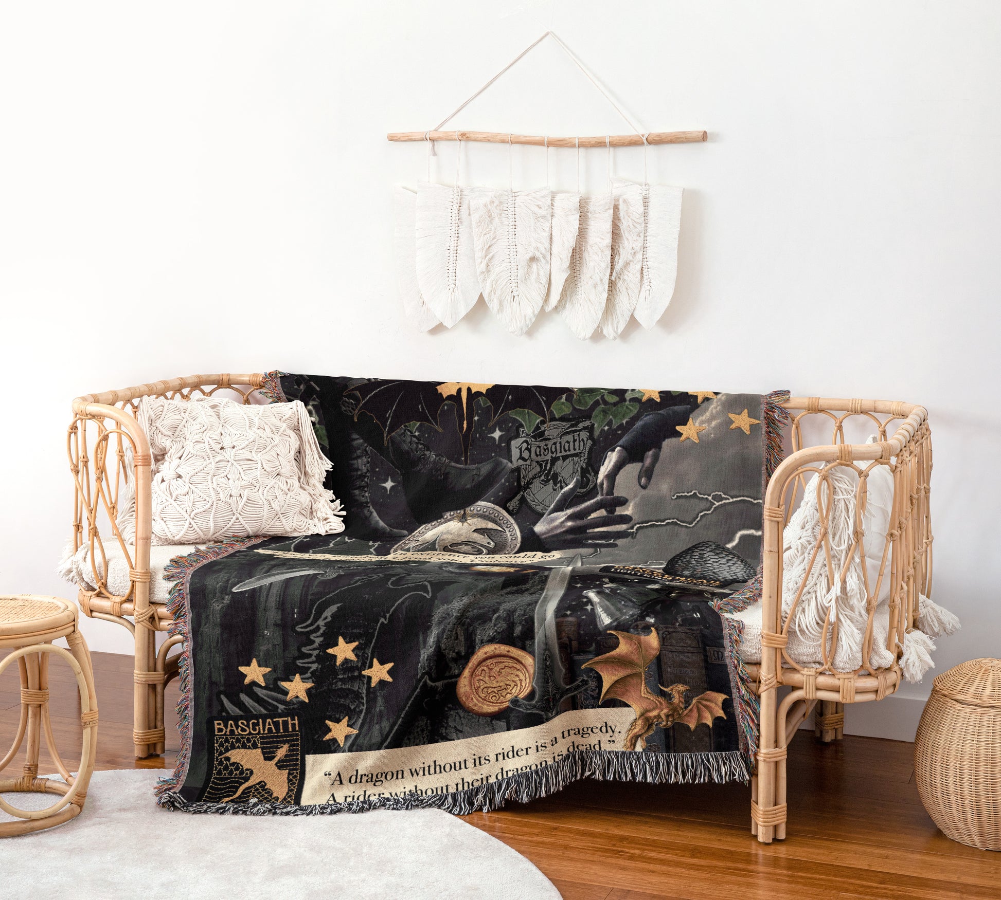 a cozy living space with a woven bench, a black and gold dragon-themed blanket, and a hanging feather decoration on the wall.