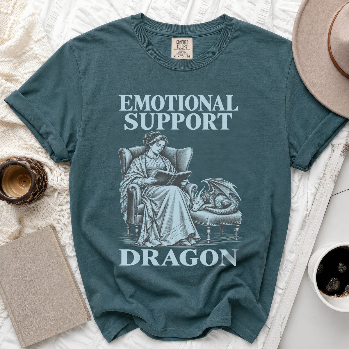 Teal t-shirt with "Emotional Support Dragon" text and vintage illustration.