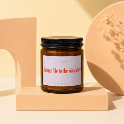 Amber glass candle with "IF FOUND, Return Me to the Bookstore" label.