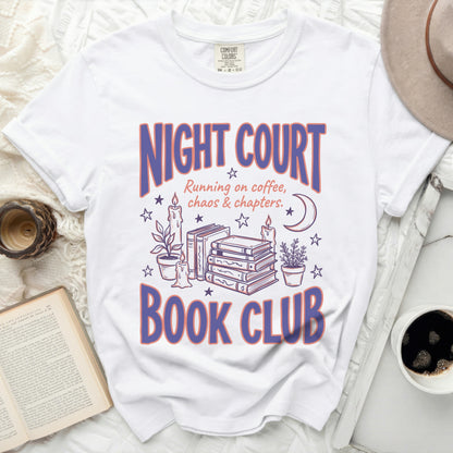 White t-shirt with "Night Court Book Club" graphic and book illustrations.
