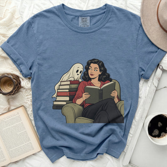 Woman reading book with a ghost peeking over a stack of books.