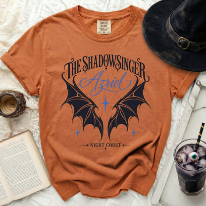Orange t-shirt with "The Shadowsinger Azriel Night Court" graphic and bat wings.