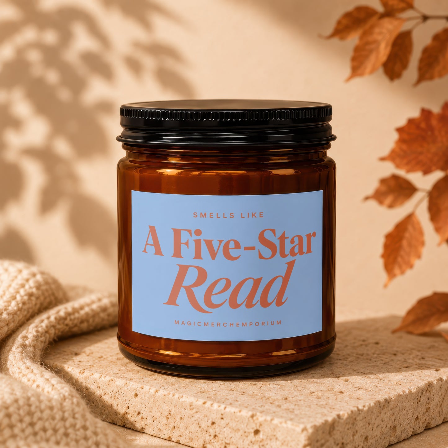 Amber jar candle with a light blue label that reads "Smells Like A Five-Star Read"