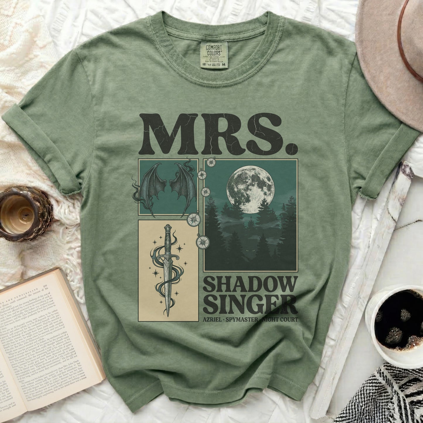 Green t-shirt with "MRS. SHADOW SINGER" and fantasy illustration.