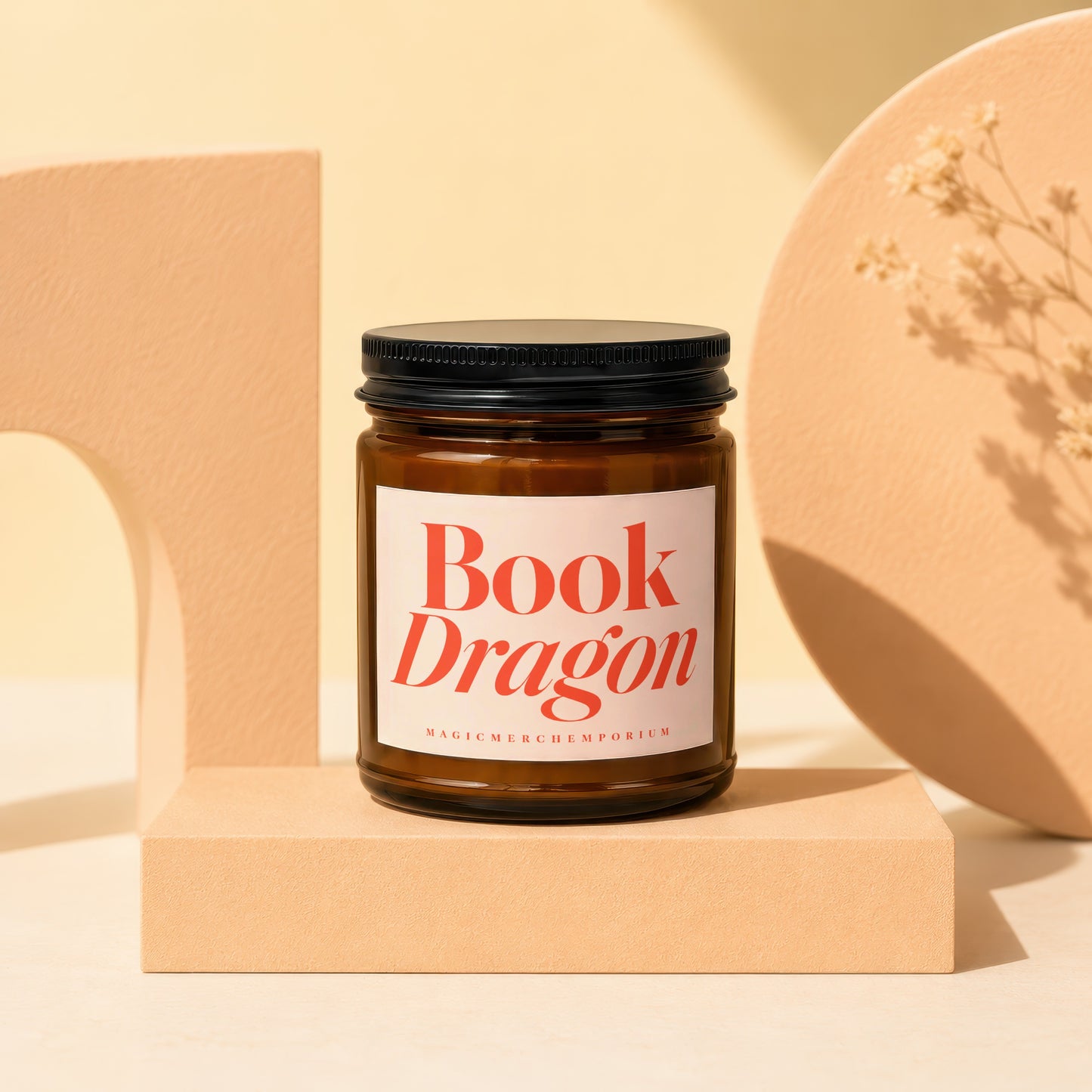 Book Dragon candle with a black lid on a beige pedestal, text reads MagicMerchEmporium.