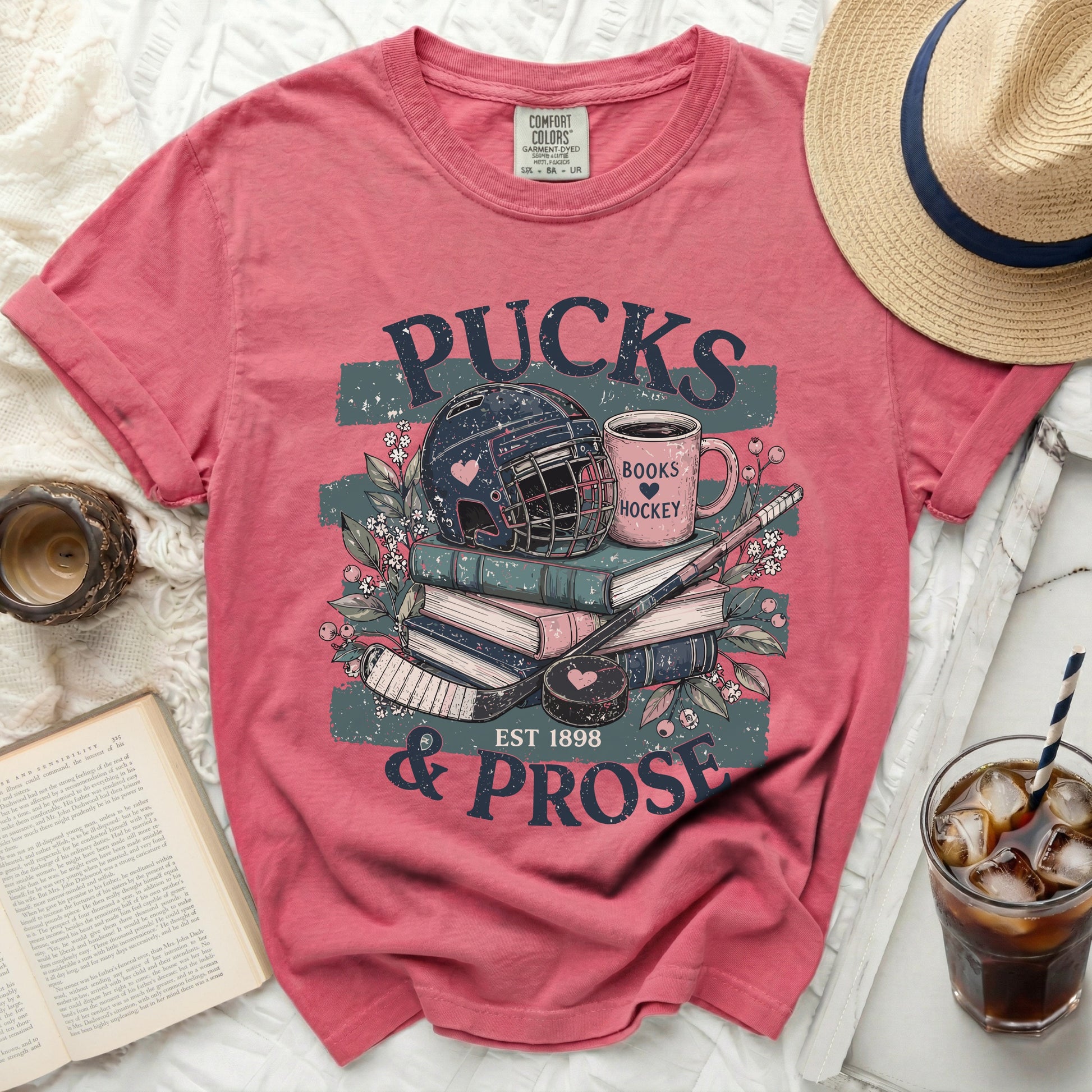Crimson t-shirt with "Pucks & Prose" and hockey imagery.