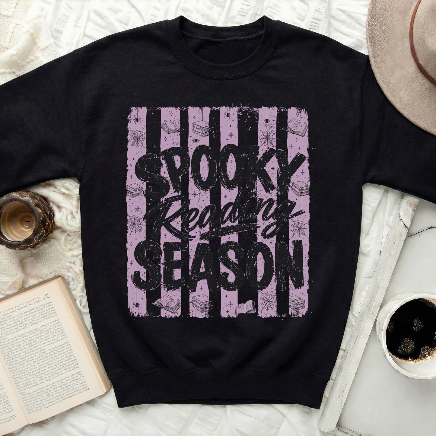 Black sweatshirt with "Spooky Reading Season" Halloween graphic.