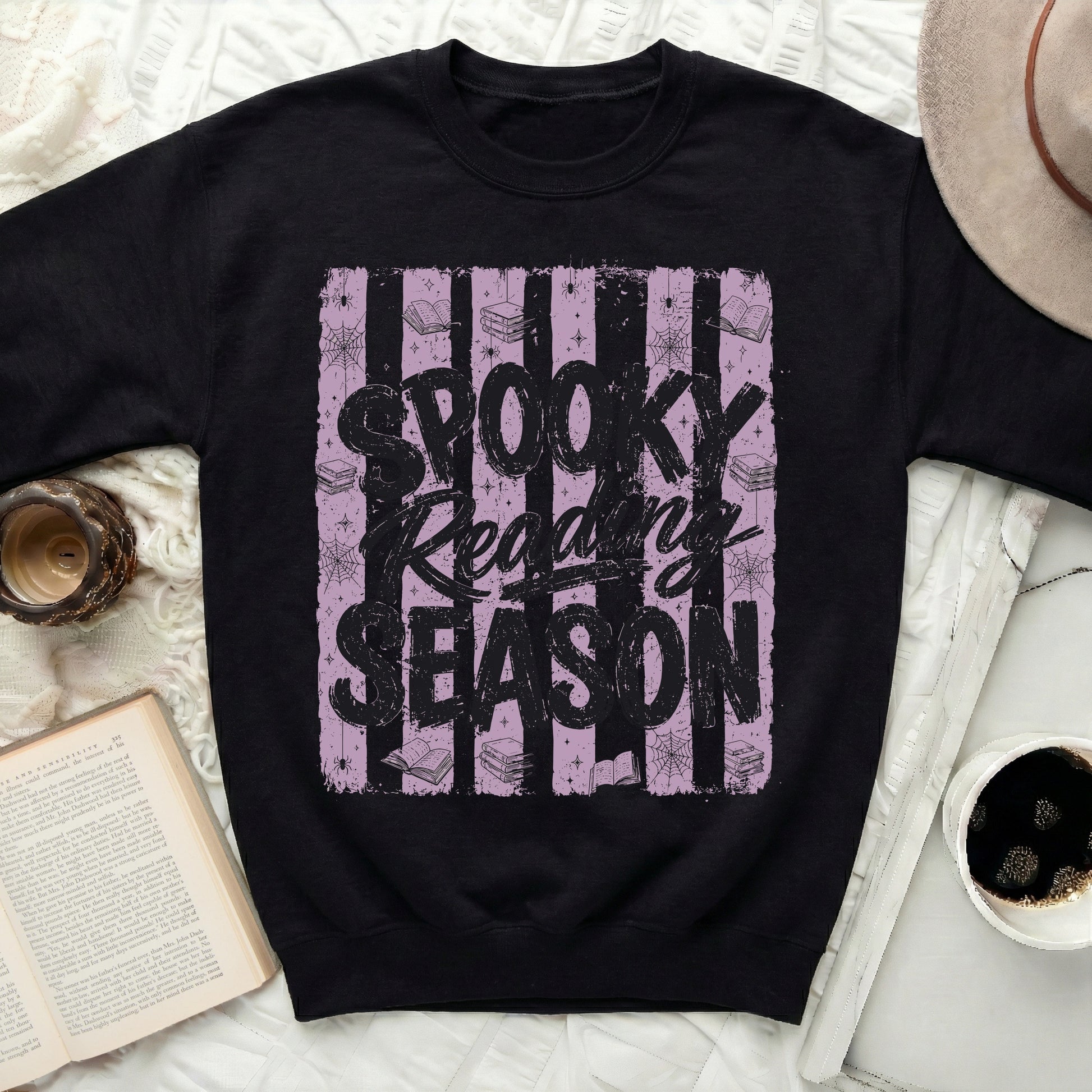 Black sweatshirt with "Spooky Reading Season" Halloween graphic.