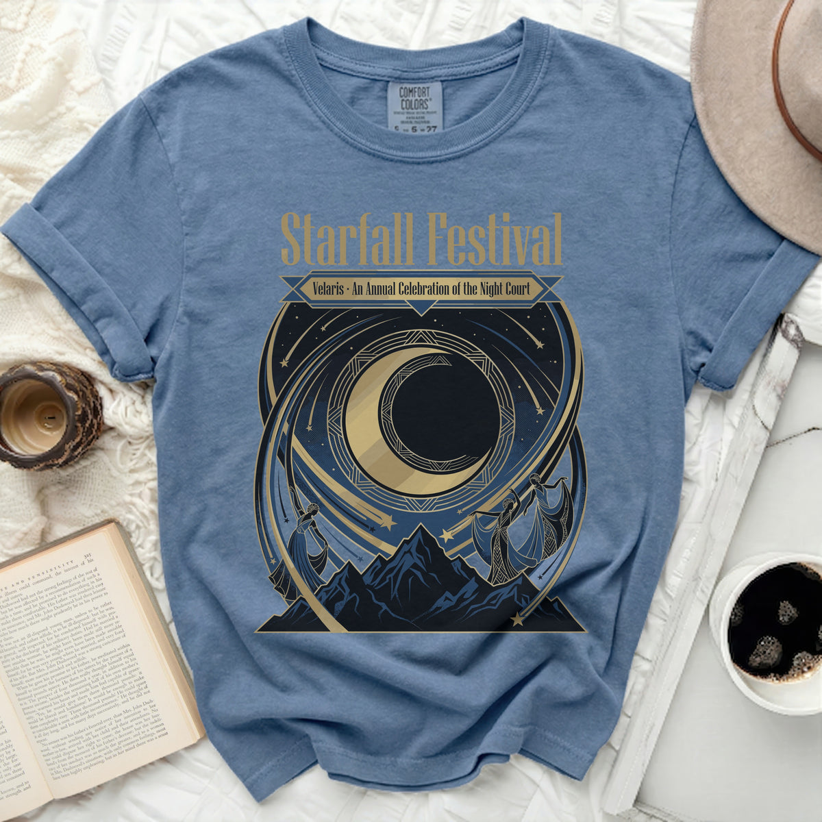 Blue t-shirt with "Starfall Festival Velaris An Annual Celebration of the Night Court" graphic.