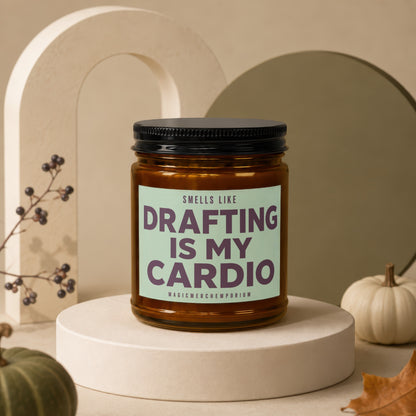 Candle with label "Smells Like Drafting Is My Cardio" on a display riser.