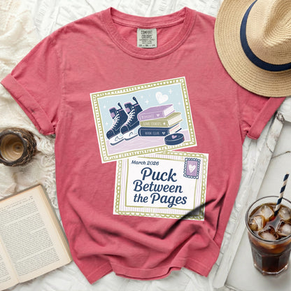 Comfort Colors shirt with "Puck Between the Pages" graphic and ice skates.
