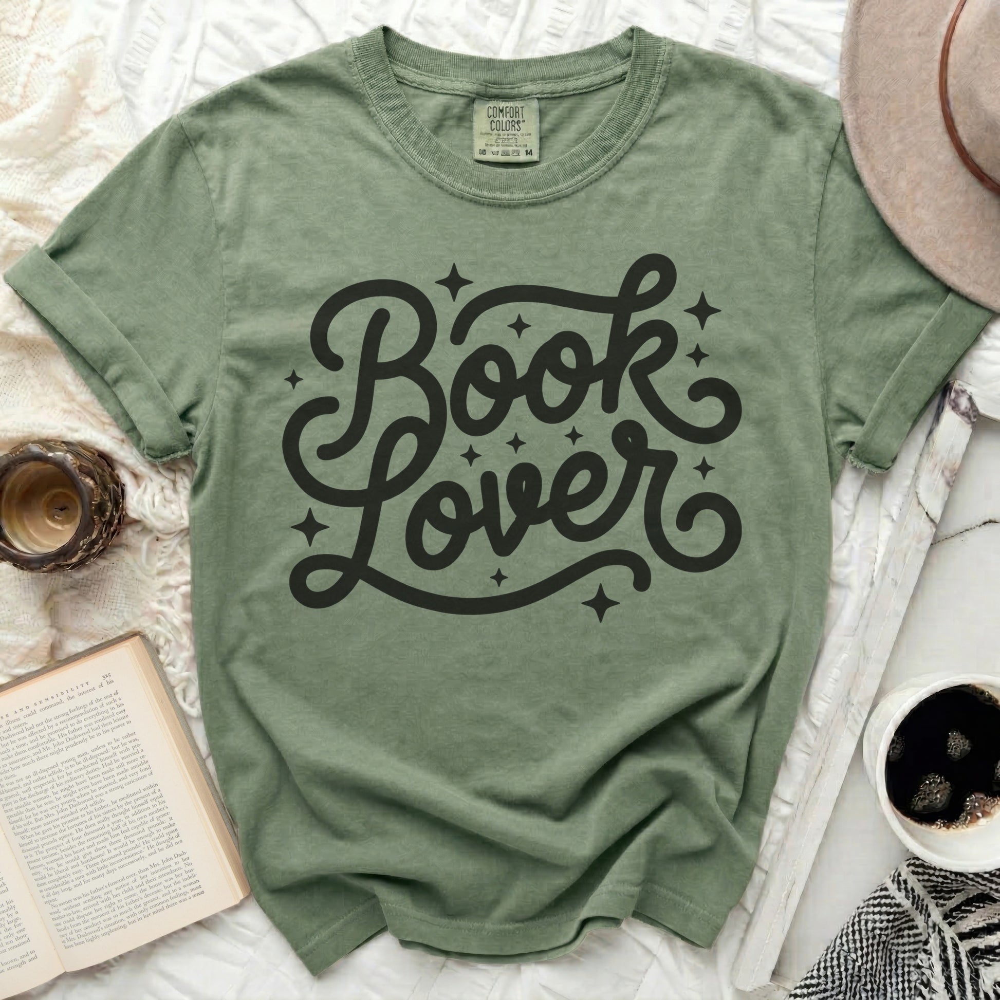 Green t-shirt with "Book Lover" text and decorative stars.