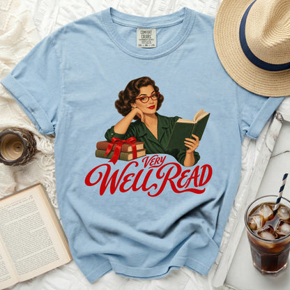 Light blue t-shirt with a retro woman reading graphic and "VERY WELL READ" text.