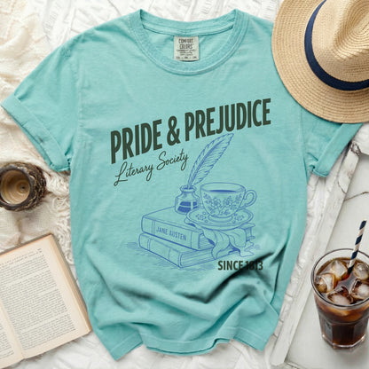Pride & Prejudice Literary Society t-shirt featuring books, inkwell, quill, and teacup.