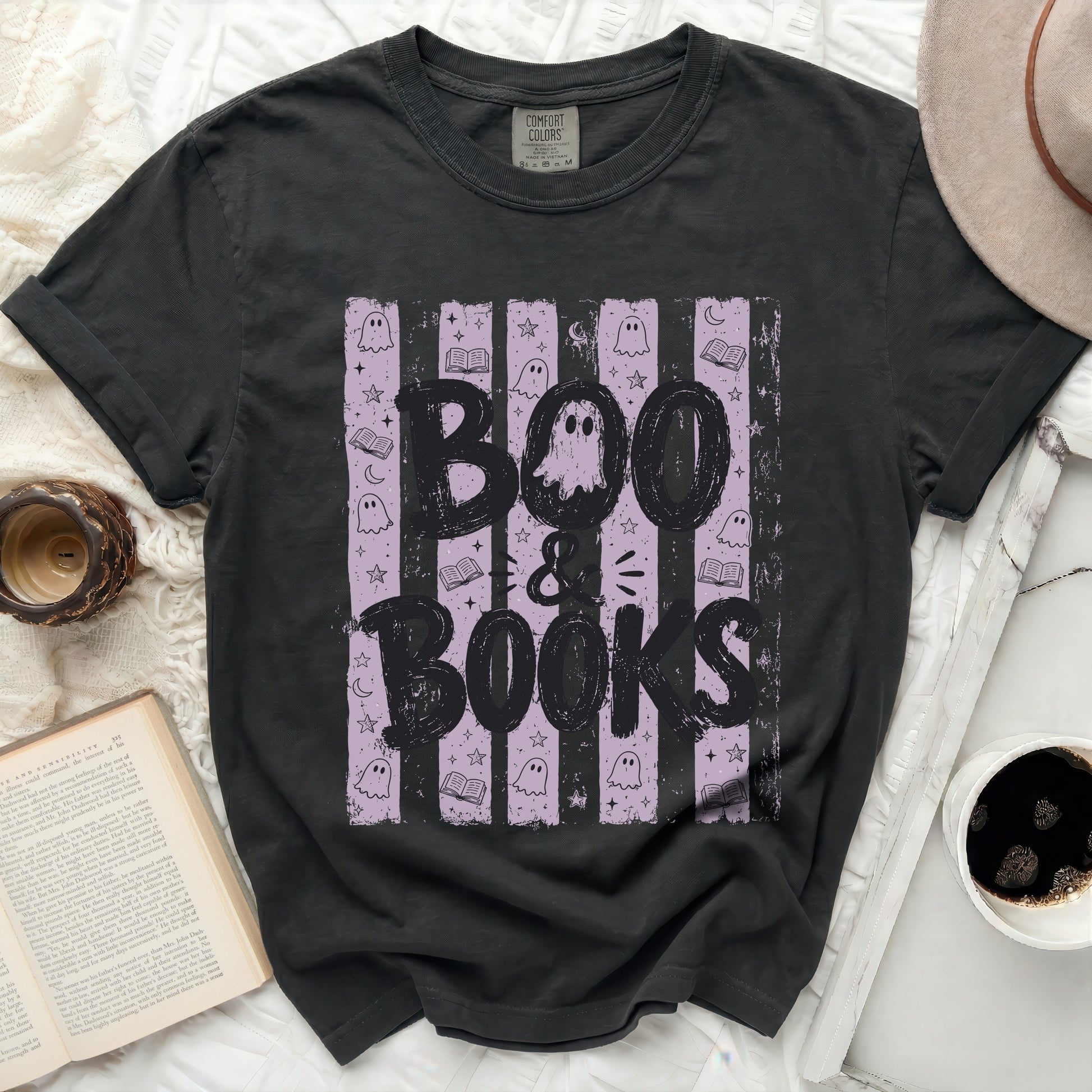 Black t-shirt with "Boo & Books" graphic and Halloween motifs.