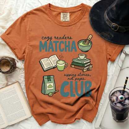 Orange t-shirt with "Cozy Readers Matcha Club" graphic, books, matcha, and a drink.