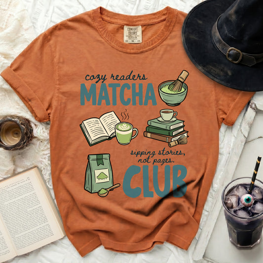 Orange t-shirt with "Cozy Readers Matcha Club" graphic, books, matcha, and a drink.
