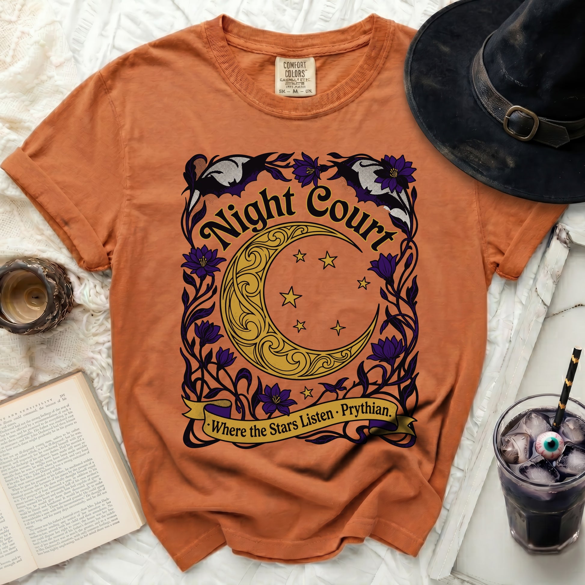 Orange t-shirt with "Night Court" and crescent moon graphic.