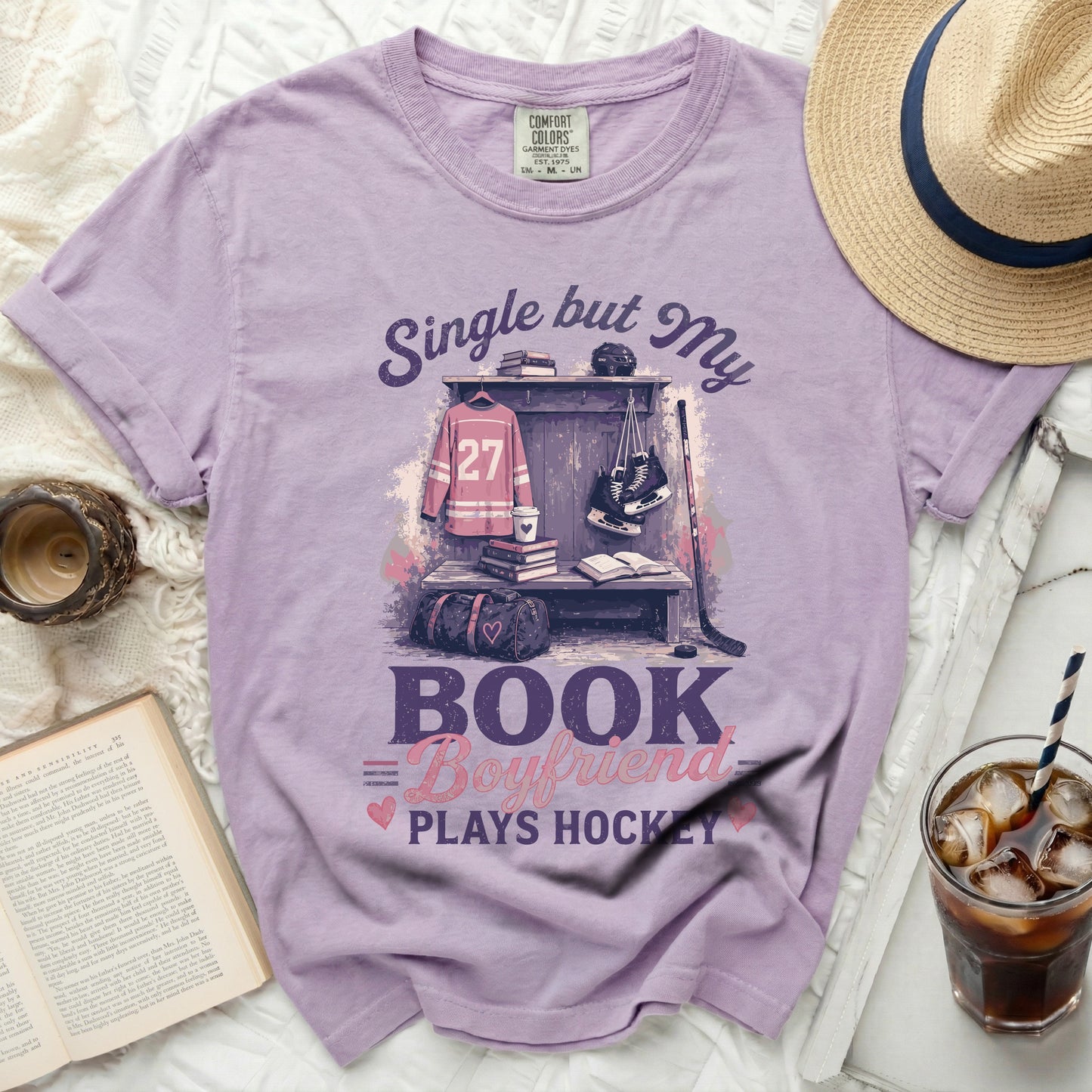 Purple t-shirt with "Single but My Boyfriend Plays Hockey" text and hockey gear graphic.