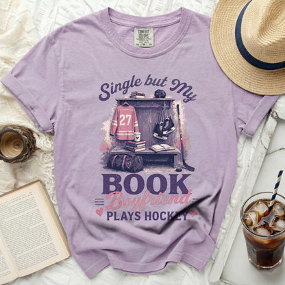 Purple t-shirt with "Single but My Boyfriend Plays Hockey" text and hockey gear graphic.