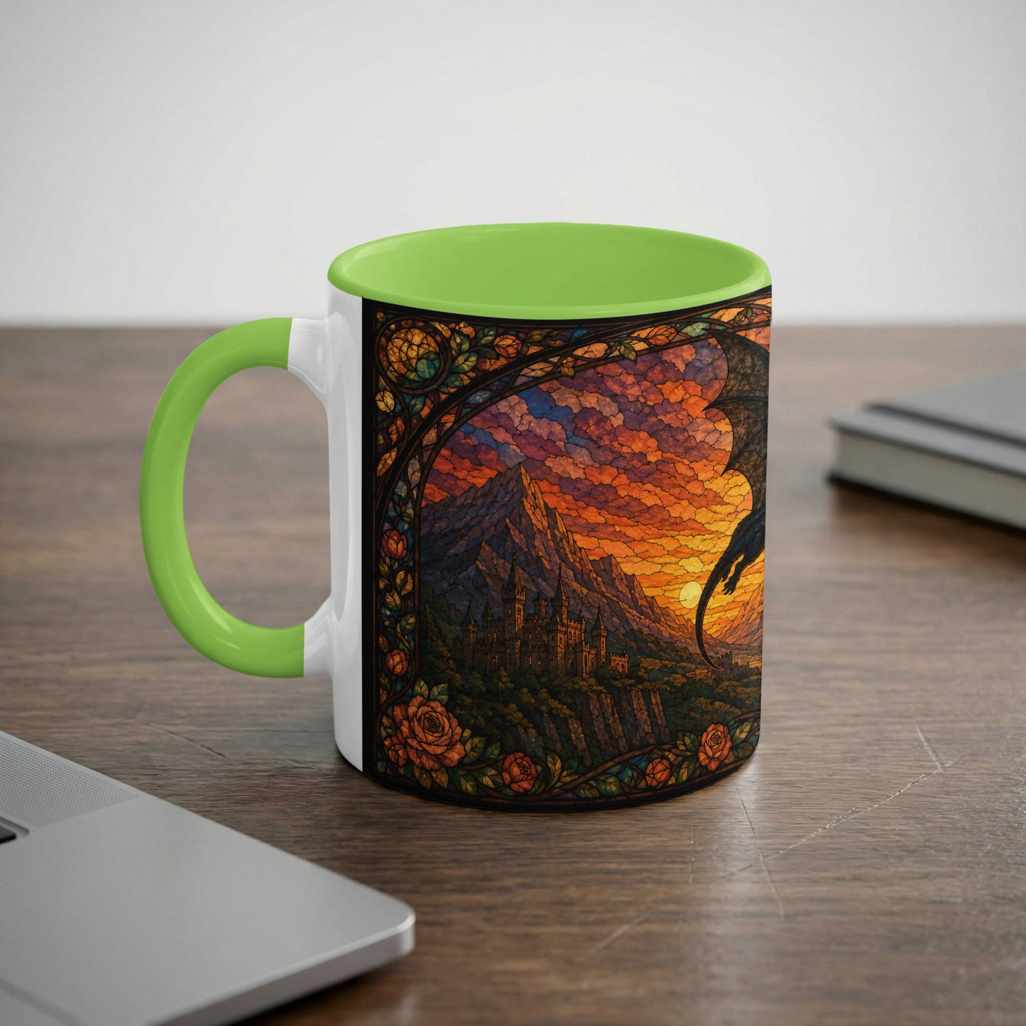 White mug with green handle featuring a stained-glass dragon, castle, and sunset design.