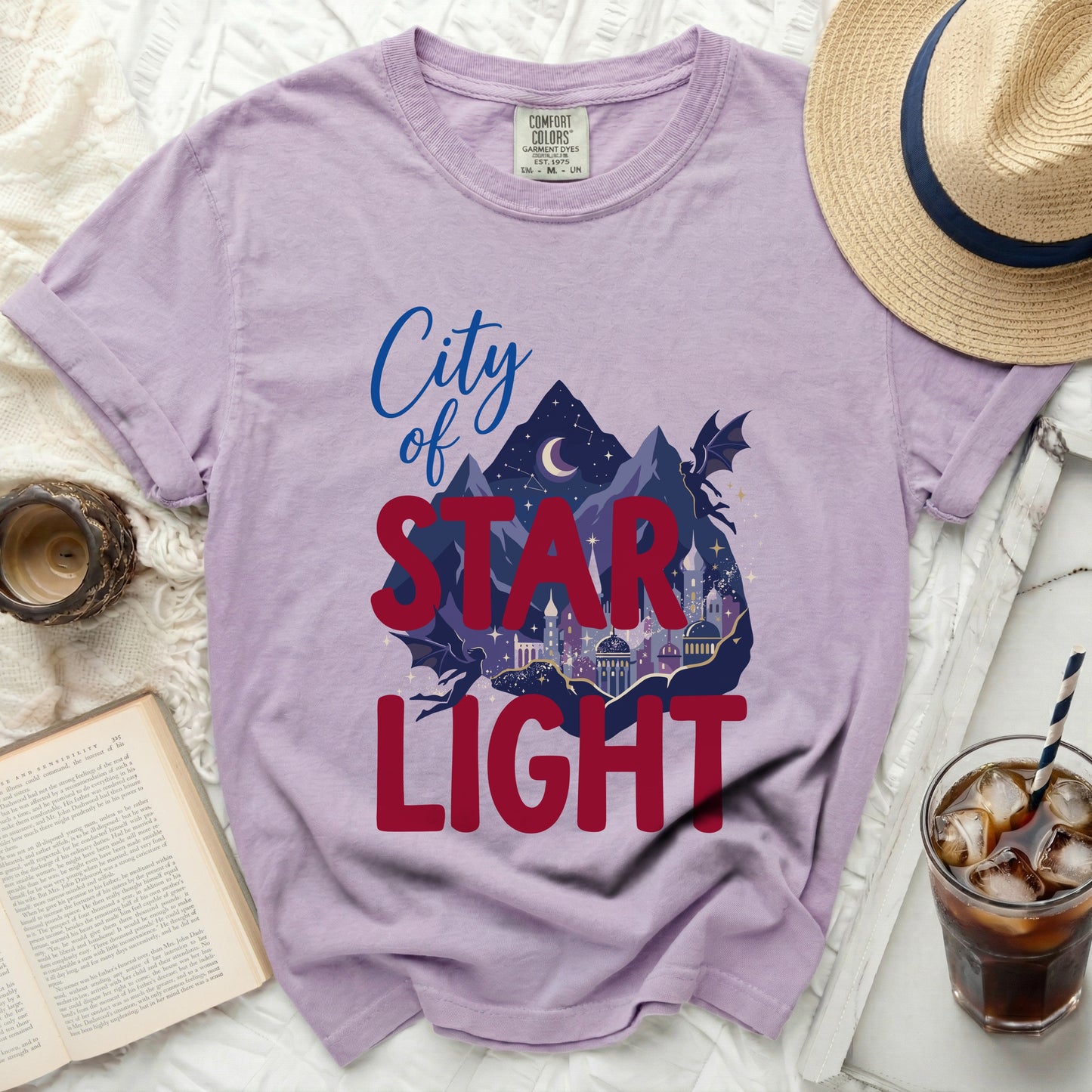 Purple t-shirt with "City of Star Light" graphic featuring a city and mountains.