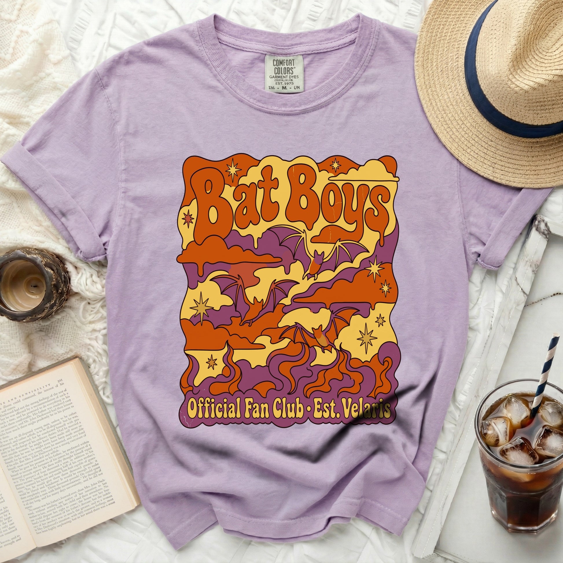 Lavender t-shirt with "Bat Boys Official Fan Club Est. Velaris" graphic.