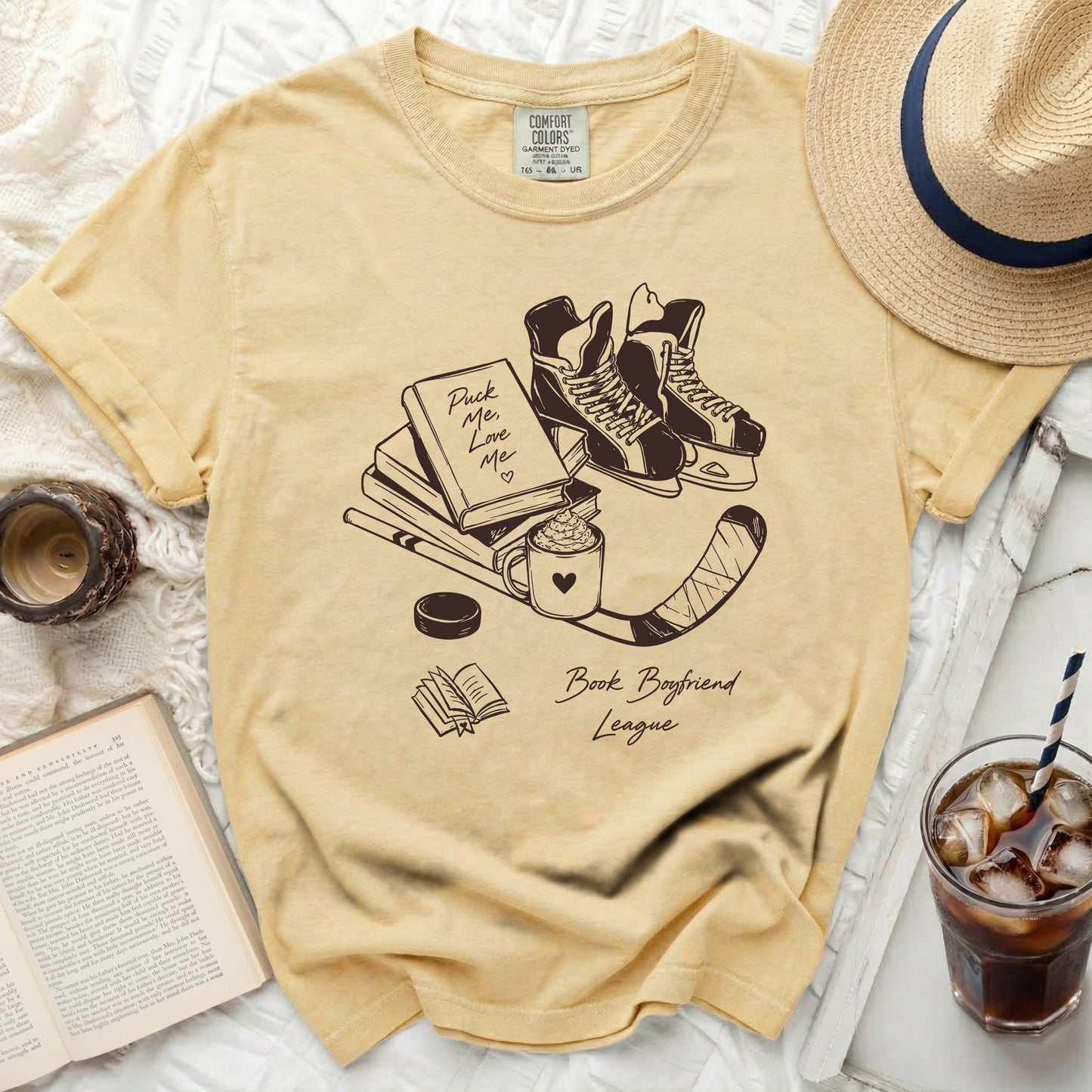 Yellow t-shirt with "Puck Me Love Me" and "Book Boyfriend League" graphics.