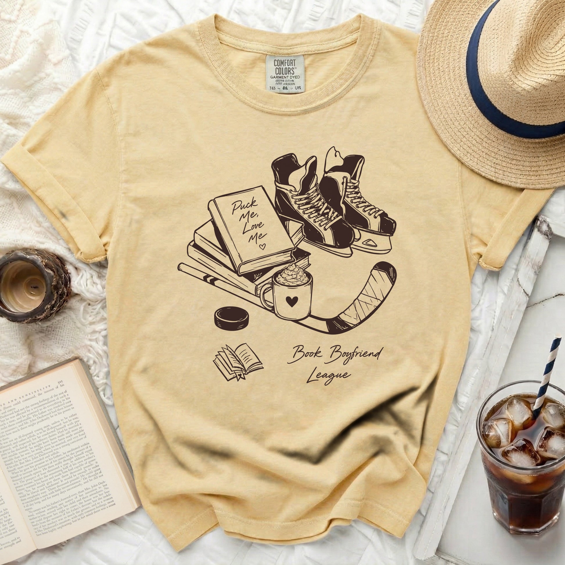 Yellow t-shirt with "Puck Me Love Me" and "Book Boyfriend League" graphics.