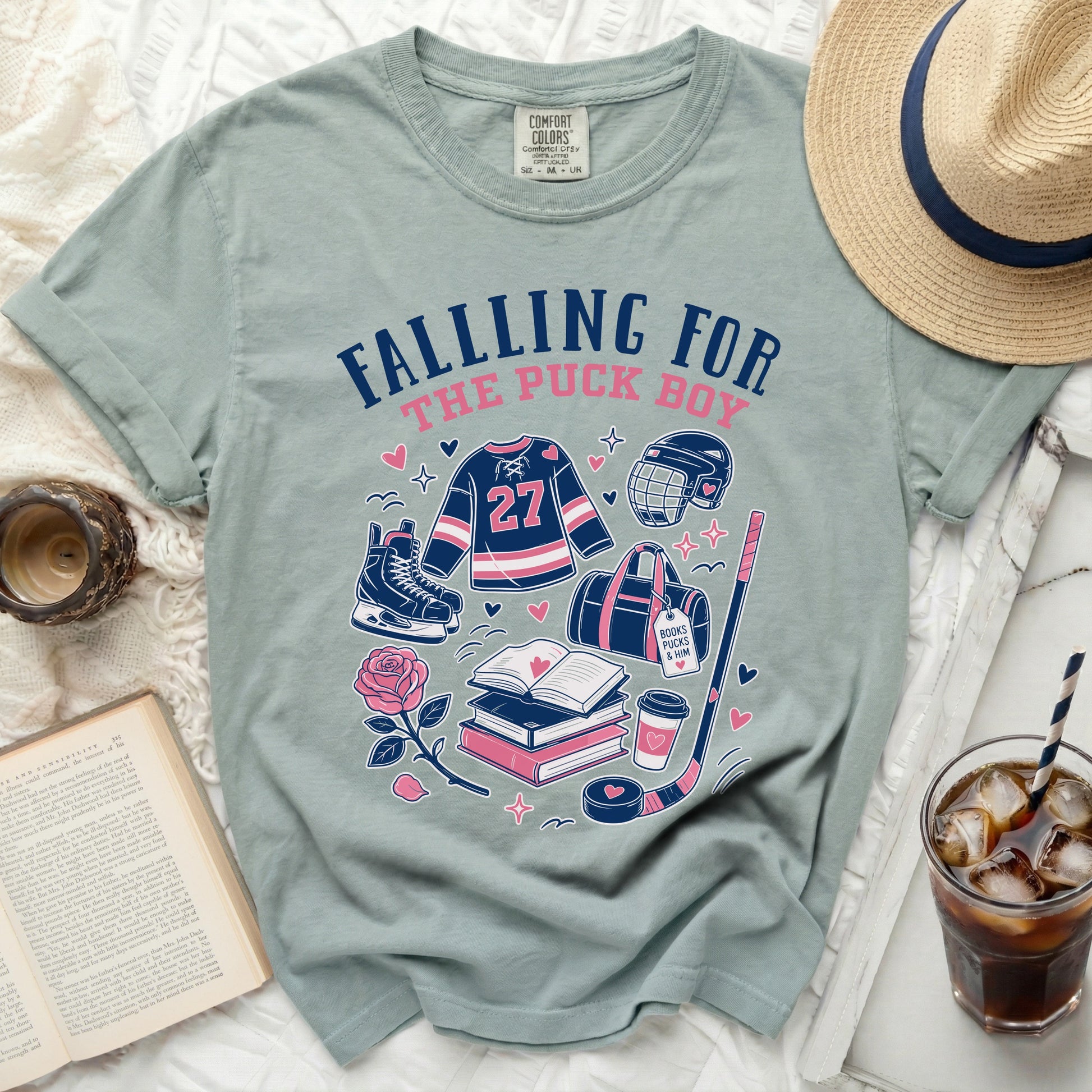 T-shirt with "Falling For The Puck Boy" text and hockey graphics.