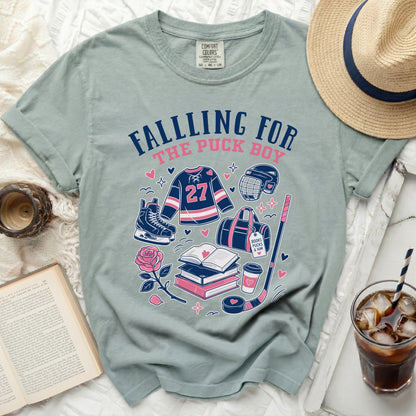 T-shirt with "Falling For The Puck Boy" text and hockey graphics.