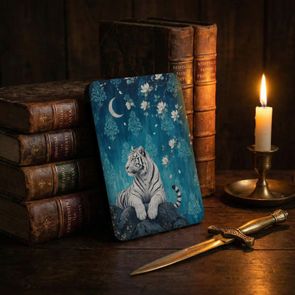 White tiger with crescent moon and flowers on a blue damask background.