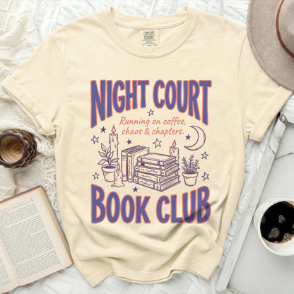 Cream t-shirt with purple "NIGHT COURT BOOK CLUB" text and illustrations.
