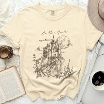 Cream t-shirt with "Be Mine, Monster." text and castle sketch.
