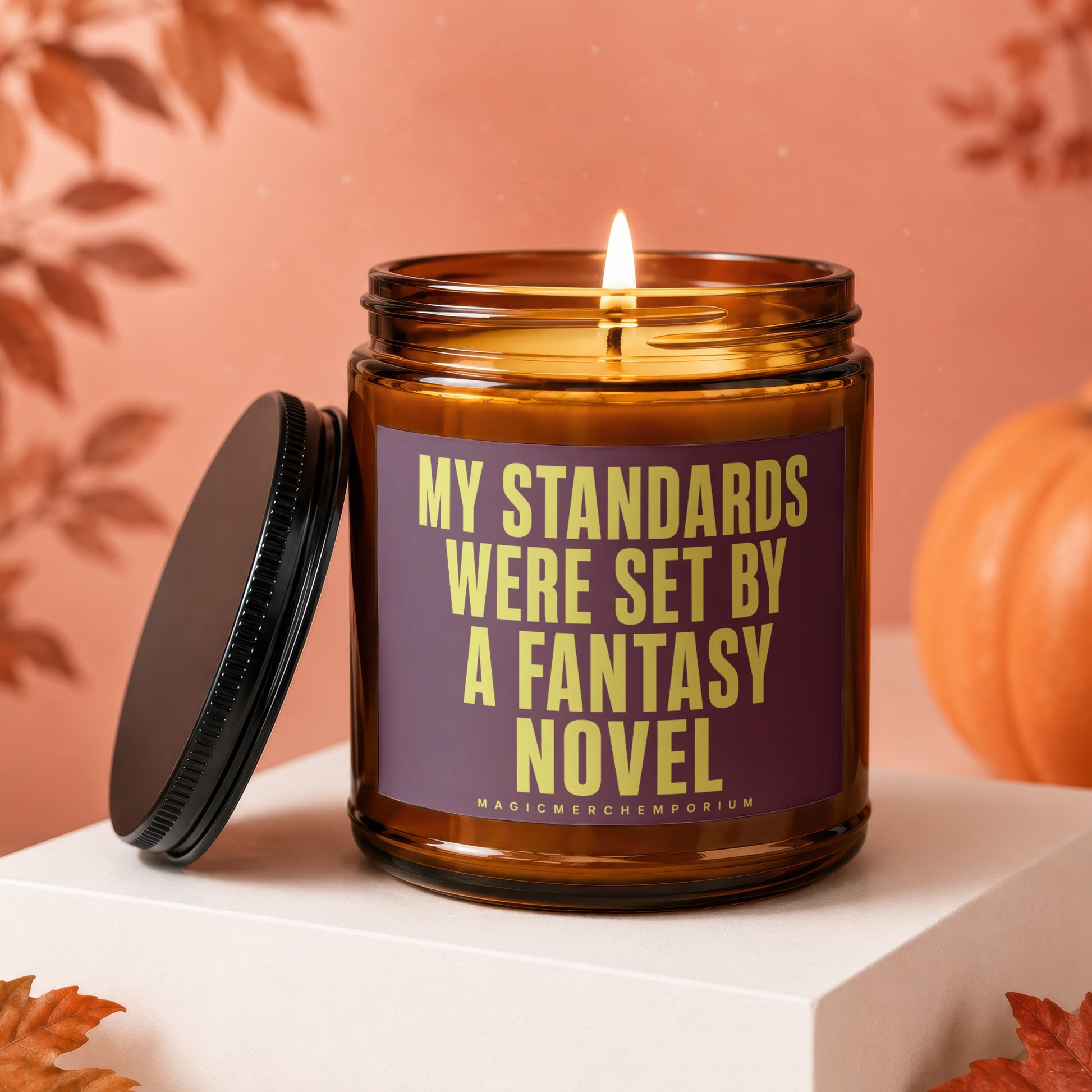 Candle with lit wick and text "My Standards Were Set By A Fantasy Novel."