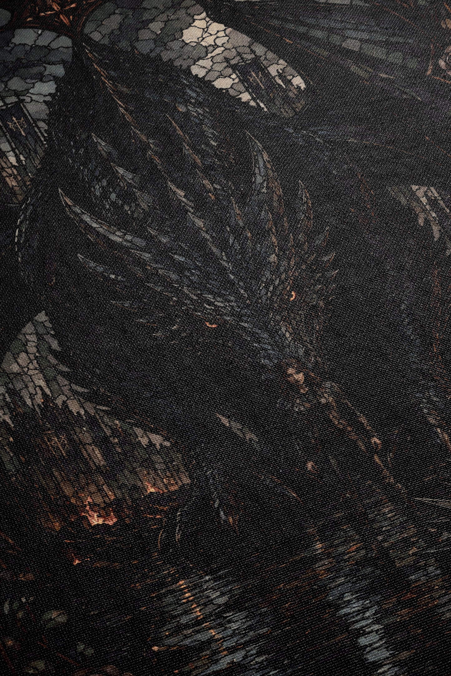 The image is a close-up of a dark, textured surface with a patterned or mosaic-like appearance. The image does not contain any discernible objects or actions, and there are no specific details provided about the content or context of the image.