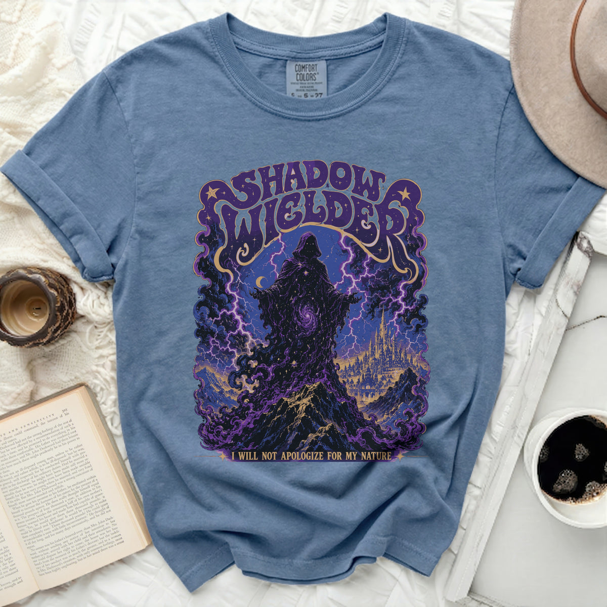 Blue t-shirt with "Shadow Wielder" graphic and lightning castle scene.