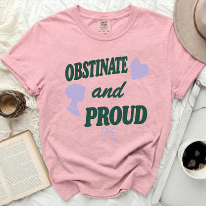 Pink t-shirt with "OBSTINATE and PROUD" text, silhouette, and heart.