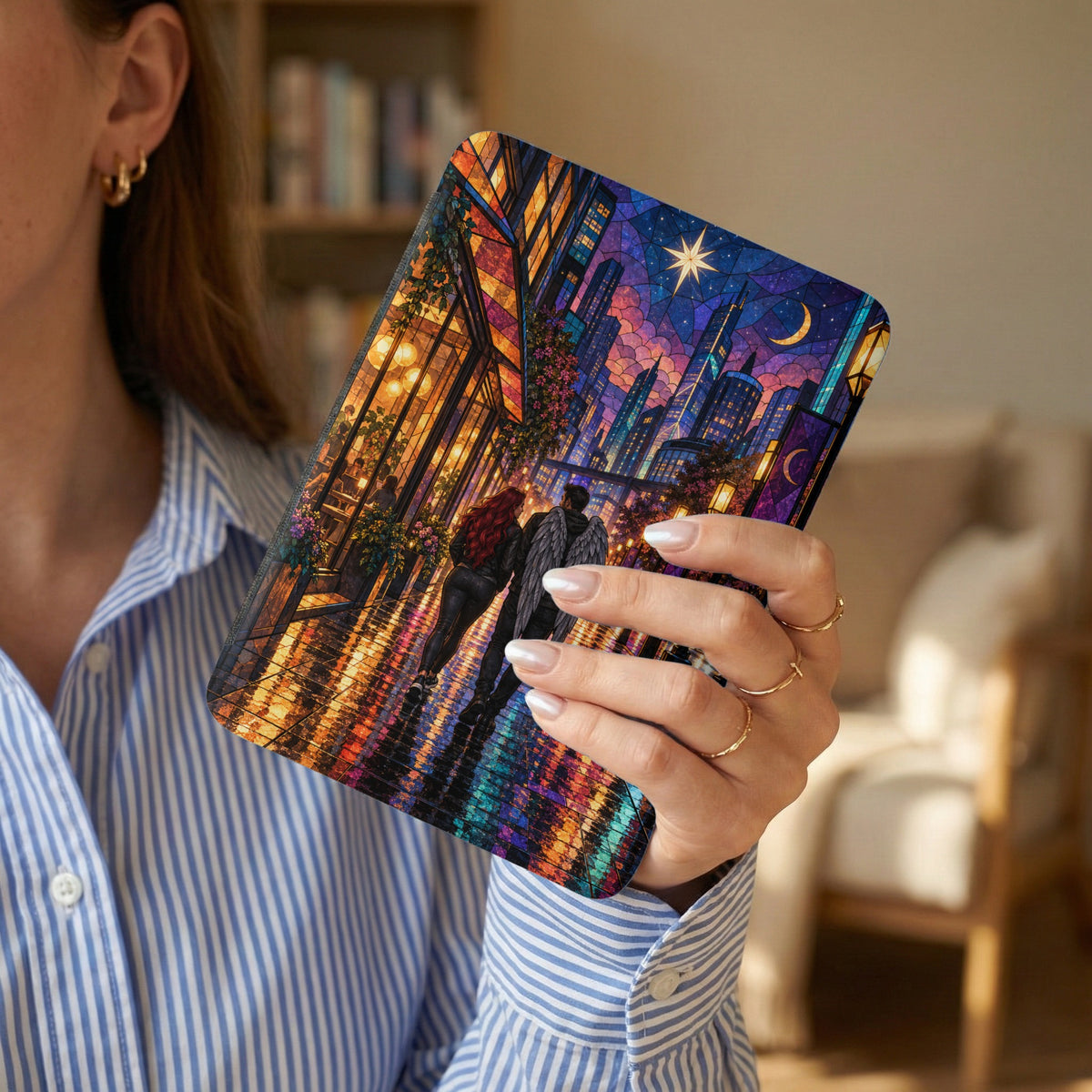 Tablet case with stained-glass design of a couple walking by a city skyline at night.