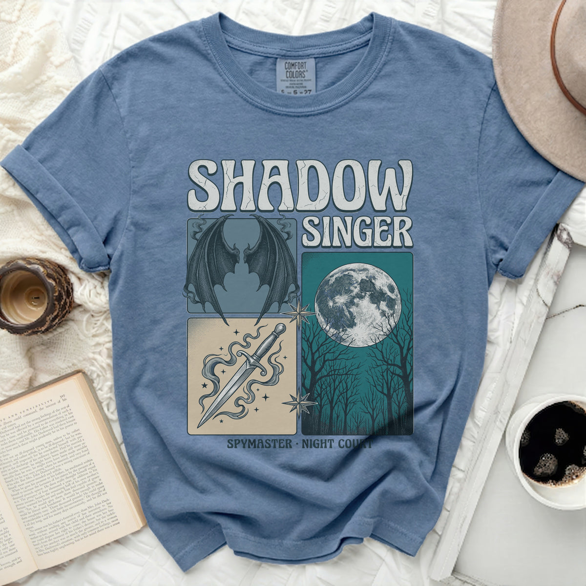Blue t-shirt with "Shadow Singer" and four illustrated panels.