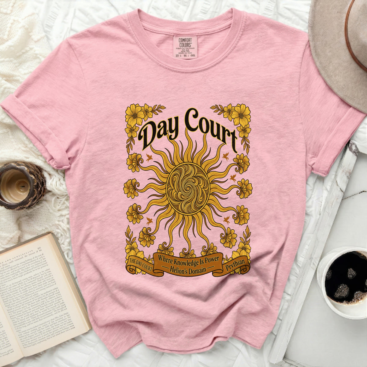 Pink t-shirt with "Day Court" and sun design, "Where Knowledge Is Power Helion's Domain"