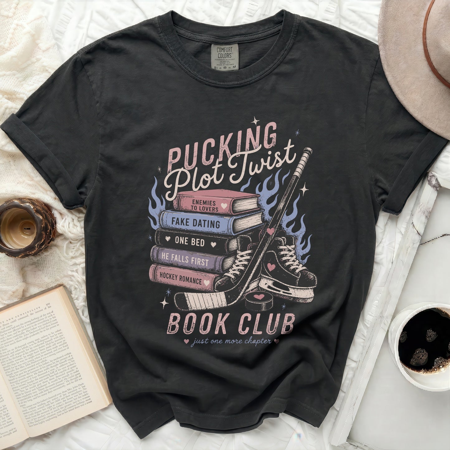 Black t-shirt with "Pucking Plot Twist Book Club" design and romance novel tropes.