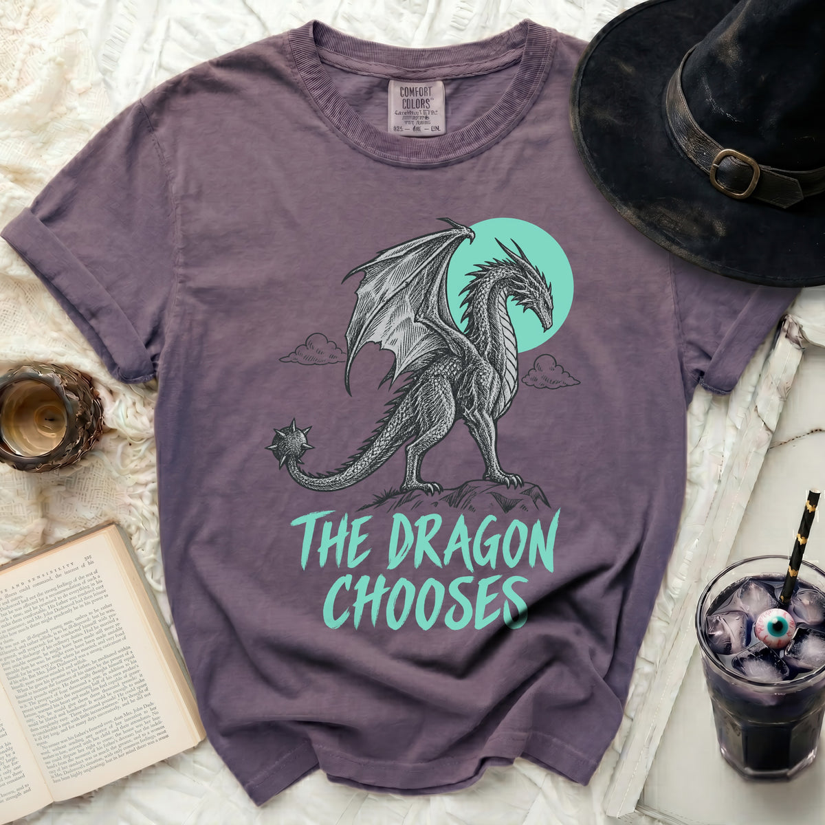 Purple t-shirt with a dragon graphic and the text "THE DRAGON CHOOSES."