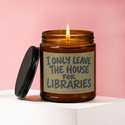 Lit candle in amber jar with black lid, text reads "I ONLY LEAVE THE HOUSE FOR LIBRARIES".