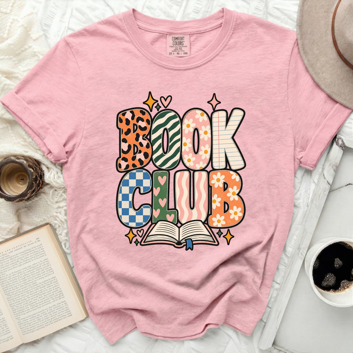 Pink t-shirt with "BOOK CLUB" graphic and an open book illustration.