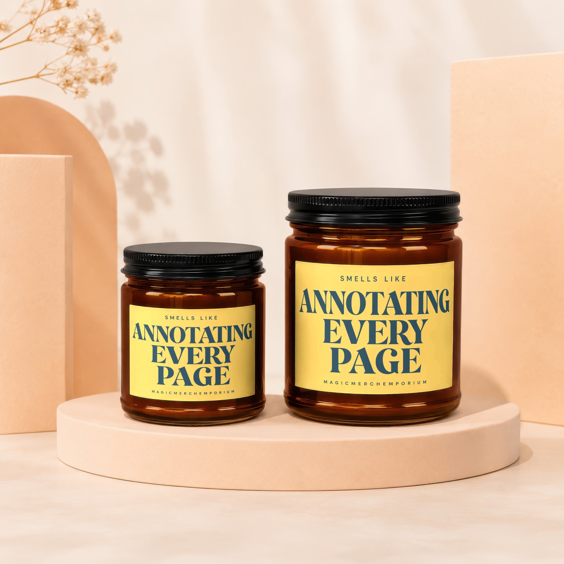 Two amber glass candles with black lids, one larger than the other, labeled "Annotating Every Page".